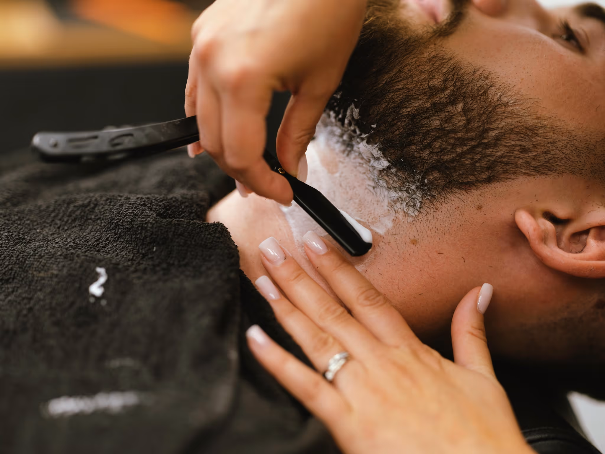 A man getting a close shave with safety razor